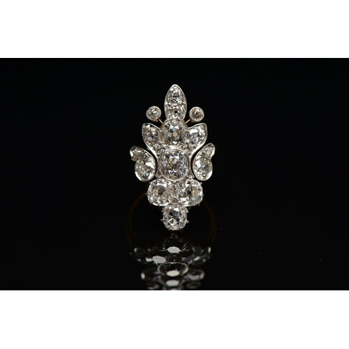 1 - AN EARLY 20TH CENTURY DIAMOND DRESS RING, comprised of seventeen old cut diamonds ranging in size, p... 