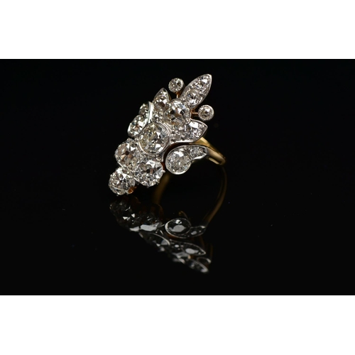 1 - AN EARLY 20TH CENTURY DIAMOND DRESS RING, comprised of seventeen old cut diamonds ranging in size, p... 