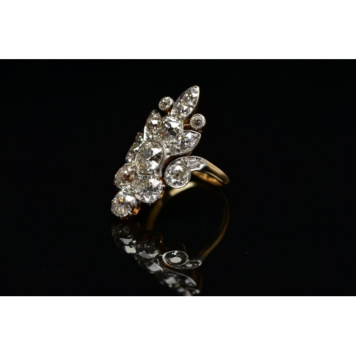 1 - AN EARLY 20TH CENTURY DIAMOND DRESS RING, comprised of seventeen old cut diamonds ranging in size, p... 