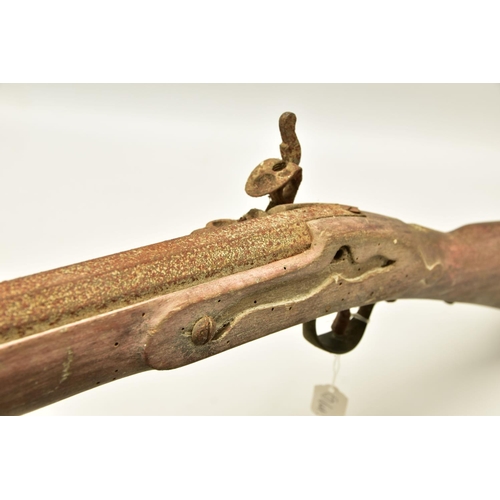 327 - AN ANTIQUE RELIC FLINTLOCK MUSKET fitted with a 51   barrel, it is missing its ramrod, top jaw and s... 