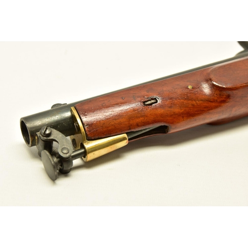 335 - AN ANTIQUE 19 BORE SINGLE BARREL PERCUSSION PISTOL fitted with a 8¼  barrel and  hinged ramrod, the ... 