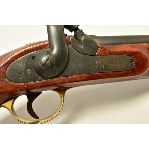 335 - AN ANTIQUE 19 BORE SINGLE BARREL PERCUSSION PISTOL fitted with a 8¼  barrel and  hinged ramrod, the ... 