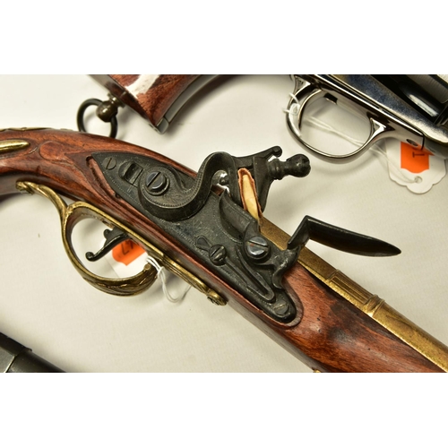 340 - THREE REPLICA PISTOLS, namely a poor quality model of a flintlock pistol, a high quality finish repl... 