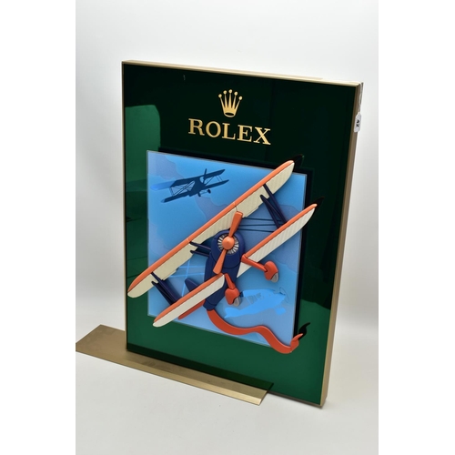 42 - A LARGE ROLEX SHOP WINDOW DISPLAY STAND WITH SLIDING MECHANISM, the central removable panel depictin... 