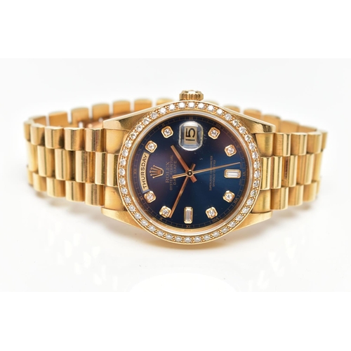 5 - AN 18CT YELLOW GOLD AND DIAMOND DAY-DATE ROLEX WRISTWATCH, the dark blue dial with diamond dot hourl... 