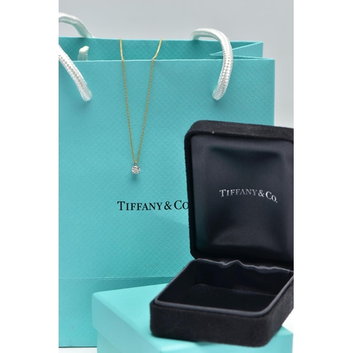 6 - AN 18CT YELLOW AND WHITE GOLD TIFFANY & CO DIAMOND PENDANT NECKLACE, set with a round brilliant cut ... 