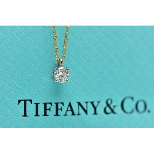 6 - AN 18CT YELLOW AND WHITE GOLD TIFFANY & CO DIAMOND PENDANT NECKLACE, set with a round brilliant cut ... 