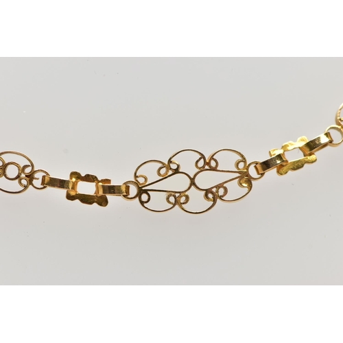 7 - A YELLOW METAL NECKLACE, designed as a series of openwork scrolling links with hook clasp, approxima... 