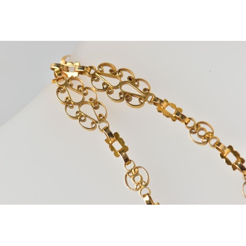 7 - A YELLOW METAL NECKLACE, designed as a series of openwork scrolling links with hook clasp, approxima... 