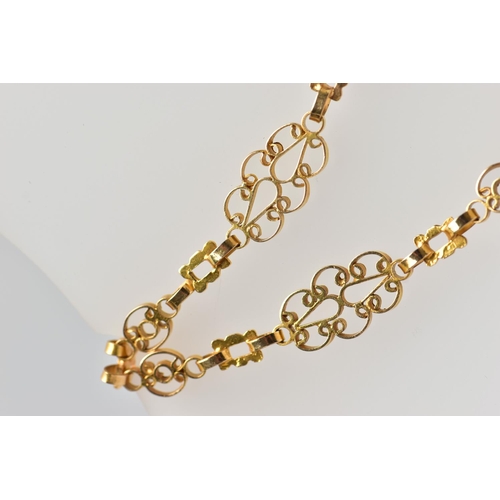 7 - A YELLOW METAL NECKLACE, designed as a series of openwork scrolling links with hook clasp, approxima... 