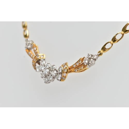 8 - A YELLOW AND WHITE METAL DIAMOND NECKLACE, the front designed as an openwork panel set throughout wi... 