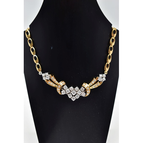 8 - A YELLOW AND WHITE METAL DIAMOND NECKLACE, the front designed as an openwork panel set throughout wi... 