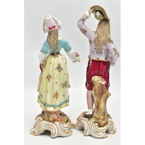 124 - A PAIR OF LATE 19TH / EARLY 20TH CENTURY CONTINENTAL PORCELAIN FIGURES OF LADY AND GENTELMAN GARDENE... 