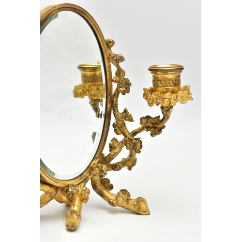 127 - A LATE 19TH /EARLY 20TH CENTURY GILT METAL TABLE TOP MIRRORED TWO BRANCH CANDELABRUM, the central ov... 