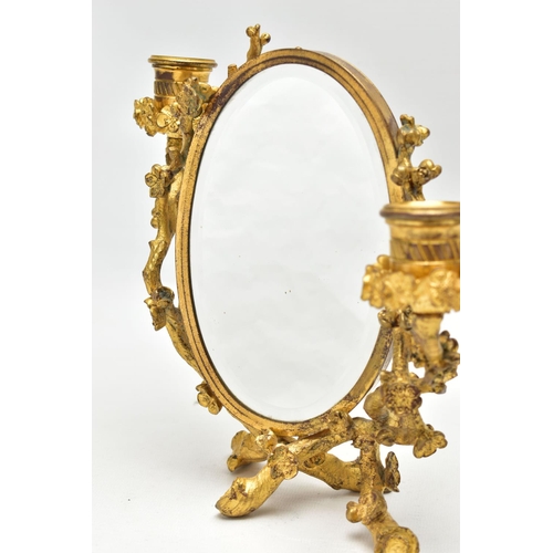 127 - A LATE 19TH /EARLY 20TH CENTURY GILT METAL TABLE TOP MIRRORED TWO BRANCH CANDELABRUM, the central ov... 