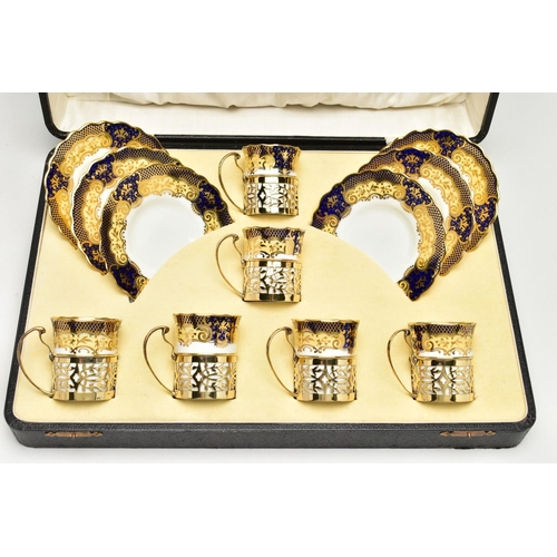 129 - A CASED SET OF SIX AYNSLEY COFFEE CANS IN SILVER GILT SLEEVES AND SIX SAUCERS, printed with a yellow... 