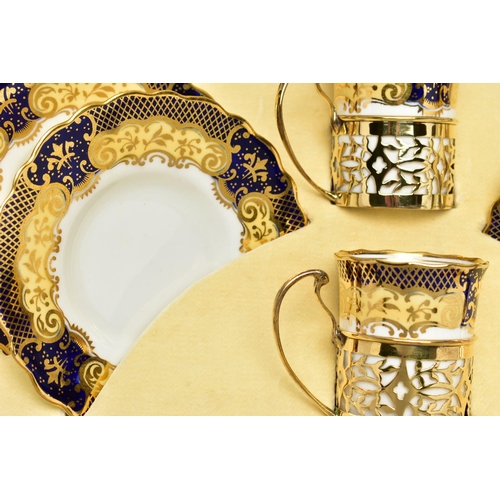 129 - A CASED SET OF SIX AYNSLEY COFFEE CANS IN SILVER GILT SLEEVES AND SIX SAUCERS, printed with a yellow... 