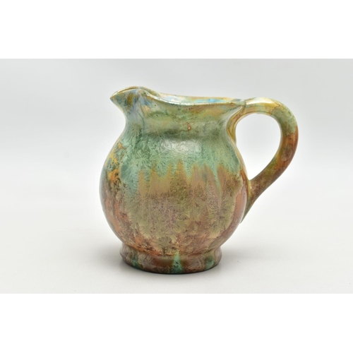 143 - PIERREFONDS - A FRENCH STUDIO POTTERY JUG, the exterior covered in green and brown crystalline glaze... 