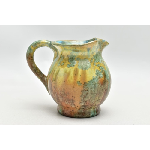 143 - PIERREFONDS - A FRENCH STUDIO POTTERY JUG, the exterior covered in green and brown crystalline glaze... 