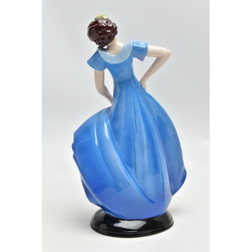 149 - A 1930'S CONTINENTAL PORCELAIN FIGURE OF A LADY IN A LONG BLUE DRESS, modelled standing on an oval b... 