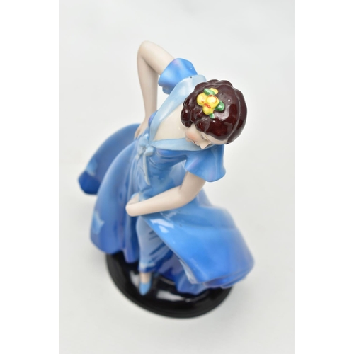 149 - A 1930'S CONTINENTAL PORCELAIN FIGURE OF A LADY IN A LONG BLUE DRESS, modelled standing on an oval b... 