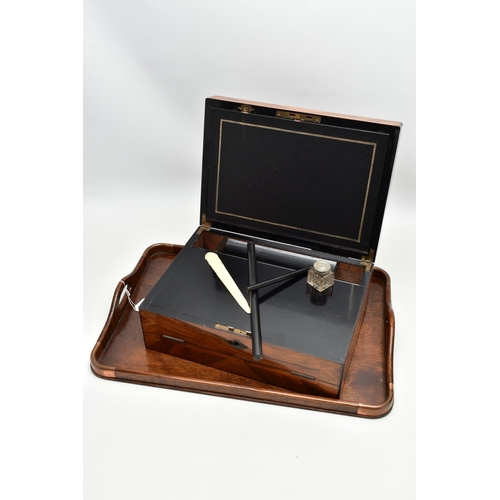 150 - AN EARLY 20TH CENTURY OAK TWIN HANDLED TRAY AND A VICTORIAN WALNUT WRITING SLOPE, the tray has four ... 