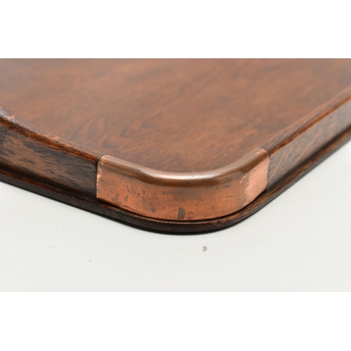 150 - AN EARLY 20TH CENTURY OAK TWIN HANDLED TRAY AND A VICTORIAN WALNUT WRITING SLOPE, the tray has four ... 