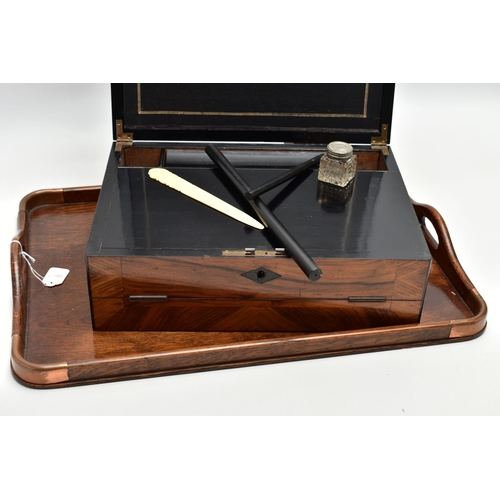 150 - AN EARLY 20TH CENTURY OAK TWIN HANDLED TRAY AND A VICTORIAN WALNUT WRITING SLOPE, the tray has four ... 