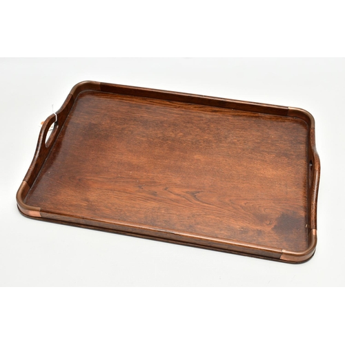 150 - AN EARLY 20TH CENTURY OAK TWIN HANDLED TRAY AND A VICTORIAN WALNUT WRITING SLOPE, the tray has four ... 