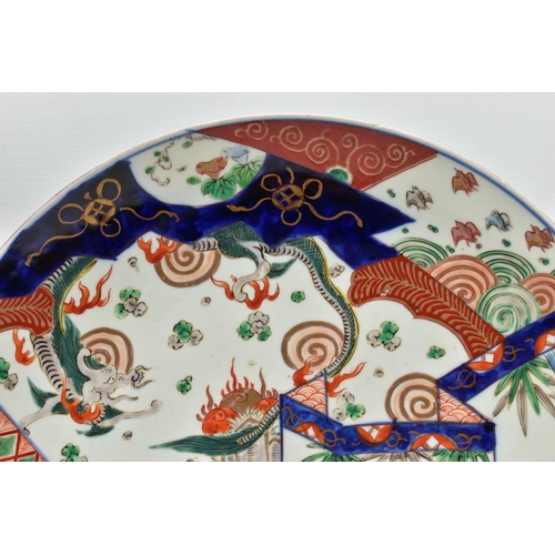 154 - THREE 19TH CENTURY JAPANESE IMARI CHARGERS, comprising a circular example decorated with a dragon, t... 