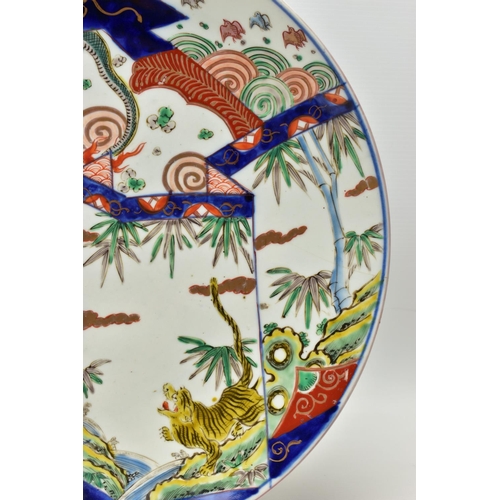 154 - THREE 19TH CENTURY JAPANESE IMARI CHARGERS, comprising a circular example decorated with a dragon, t... 