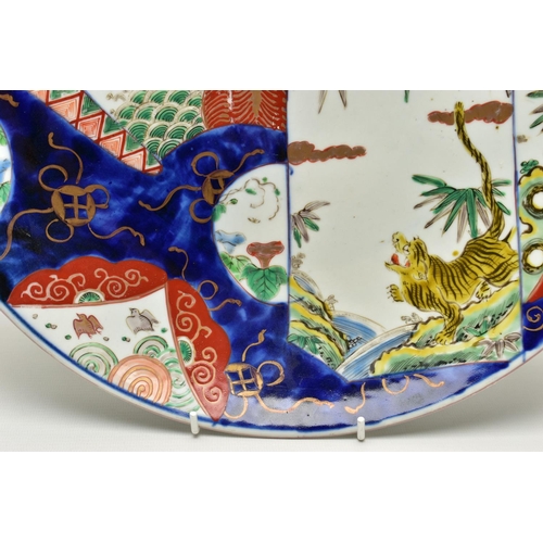 154 - THREE 19TH CENTURY JAPANESE IMARI CHARGERS, comprising a circular example decorated with a dragon, t... 