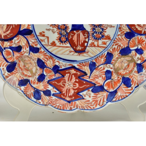 154 - THREE 19TH CENTURY JAPANESE IMARI CHARGERS, comprising a circular example decorated with a dragon, t... 