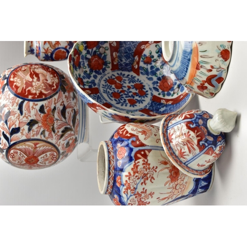 156 - A GROUP OF LATE 19TH AND EARLY 20TH CENTURY JAPANESE IMARI PORCELAIN, the majority with damage and i... 