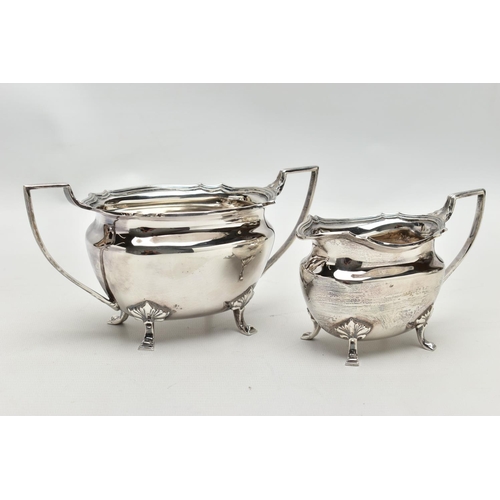 48 - A FOUR PIECE SILVER TEA SERVICE OF SHAPED OVAL FORM, comprising tea pot, hot water jug, milk jug and... 