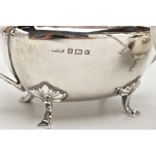 48 - A FOUR PIECE SILVER TEA SERVICE OF SHAPED OVAL FORM, comprising tea pot, hot water jug, milk jug and... 