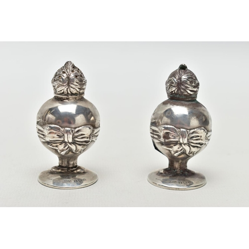 55 - A PAIR OF GEORGE V SILVER NOVELTY SALT AND PEPPER POTS IN THE FORM OF 'LITTLE TOM TUCKER', the head ... 