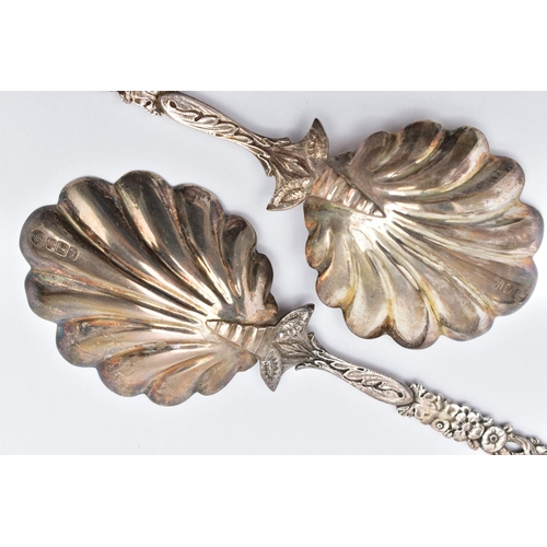 56 - A PAIR OF LATE VICTORIAN SILVER SERVING SPOONS, each with a shell shape bowl, floral and foliate dec... 