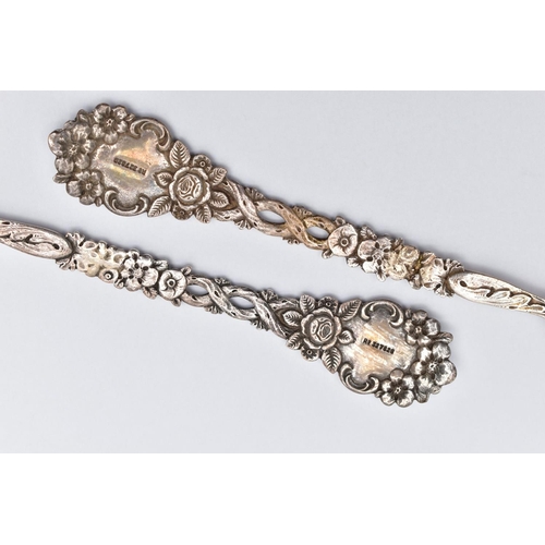 56 - A PAIR OF LATE VICTORIAN SILVER SERVING SPOONS, each with a shell shape bowl, floral and foliate dec... 