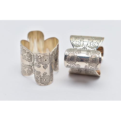 57 - A PAIR OF EDWARDIAN SILVER NAPKIN RINGS, two lobed designed napkin rings, detailed with floral engra... 