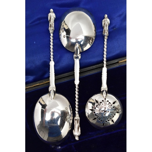 59 - A CASED SILVER SERVING SET, three silver apostle spoons to include one sifter spoon and two serving ... 