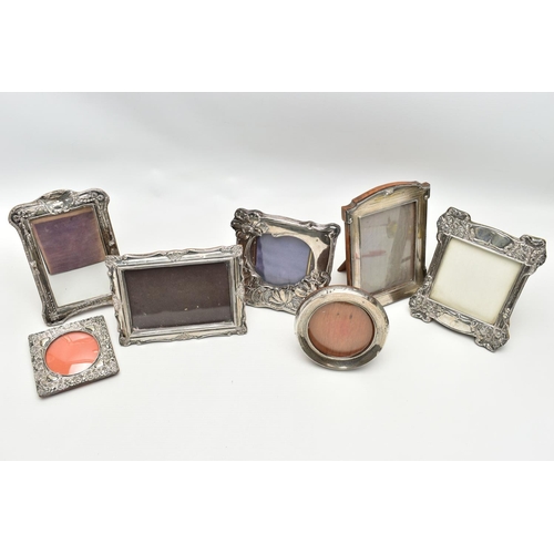 62 - SEVEN ASSORTED SILVER PHOTOGRAPH FRAMES, rectangular and circular apertures, mostly Edwardian in dat... 