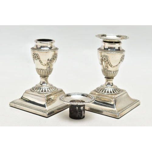 64 - A PAIR OF LATE VICTORIAN SILVER DWARF CANDLESTICKS, beaded rims throughout, the urn shaped candlehol... 