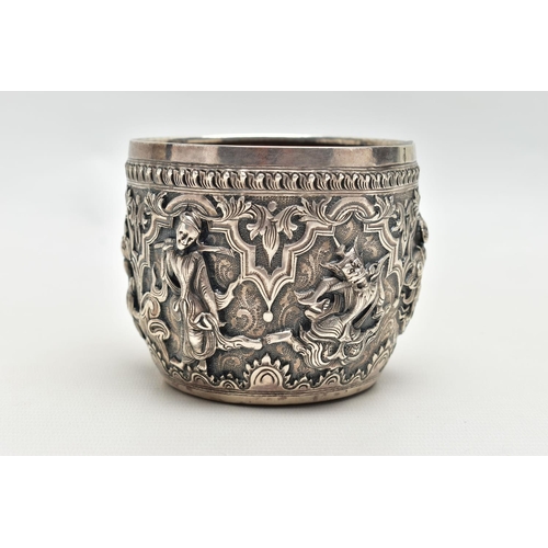 66 - A LATE 19TH / EARLY 20TH CENTURY INDIAN SILVER BOWL, the exterior cast in relief with figures dancin... 