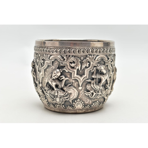 66 - A LATE 19TH / EARLY 20TH CENTURY INDIAN SILVER BOWL, the exterior cast in relief with figures dancin... 