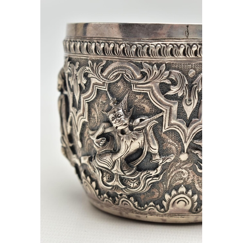 66 - A LATE 19TH / EARLY 20TH CENTURY INDIAN SILVER BOWL, the exterior cast in relief with figures dancin... 