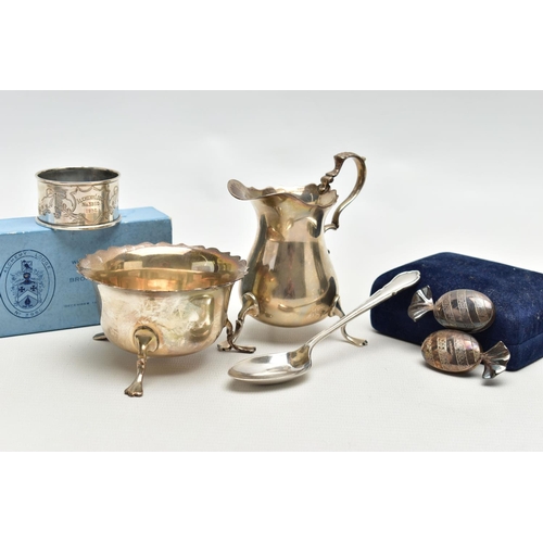 69 - AN ELIZABETH II SILVER CREAM JUG AND SUGAR BOWL AND THREE OTHER ITEMS OF SILVER, the baluster shaped... 