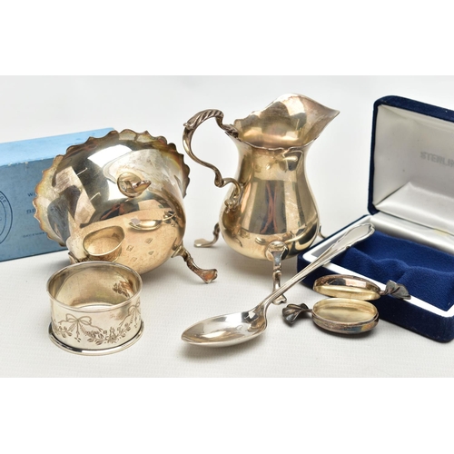 69 - AN ELIZABETH II SILVER CREAM JUG AND SUGAR BOWL AND THREE OTHER ITEMS OF SILVER, the baluster shaped... 