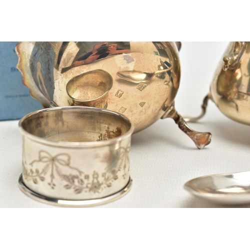 69 - AN ELIZABETH II SILVER CREAM JUG AND SUGAR BOWL AND THREE OTHER ITEMS OF SILVER, the baluster shaped... 