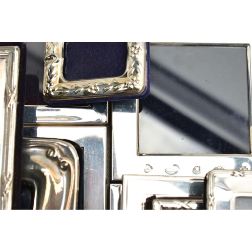 71 - TWELVE SILVER PHOTOGRAPH FRAMES AND TWO SMALL SILVER PLATED BOWLS, all of the photograph frames are ... 